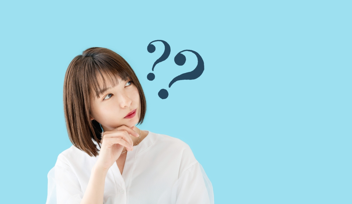 金属アレルギーでもインプラント治療が受けられるか疑問な女性